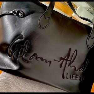 Black and pink tote similar to neverful